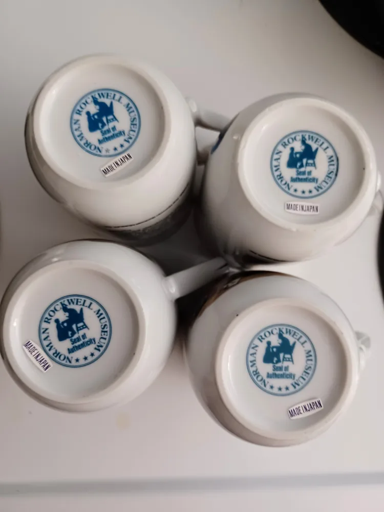 Set of 4 Vintage Gold rimmed Norman Rockwell Collector's mugs image indicator(8)