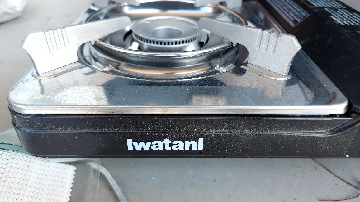 like new portable gas butane stove plus two canisters thumbnail