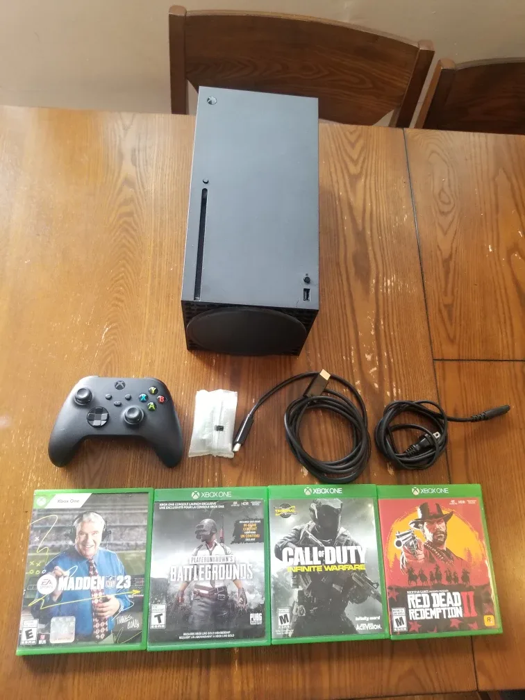 Xbox Series X 1TB Console Bundle + 4 Games and Accessories image indicator(4)