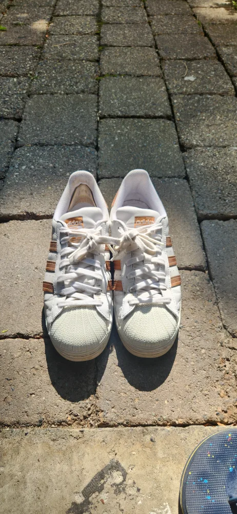 Adidas Superstar with gold stripes thumbnail