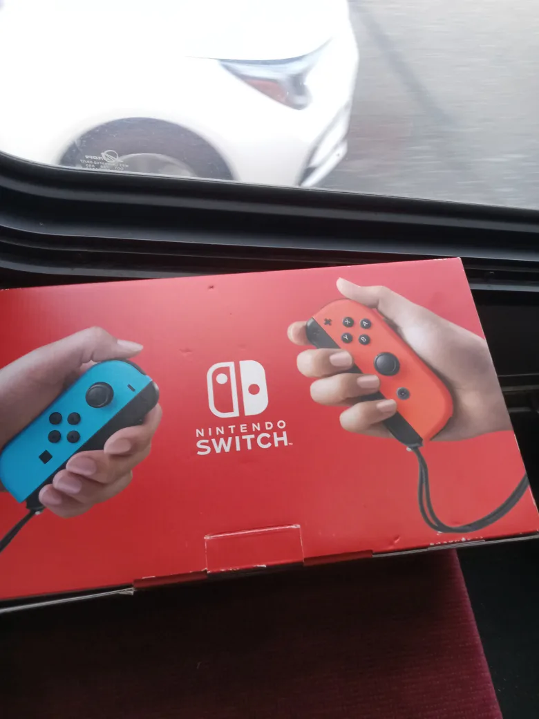 Nintendo Switch with Neon Blue and Red Joy-Con thumbnail