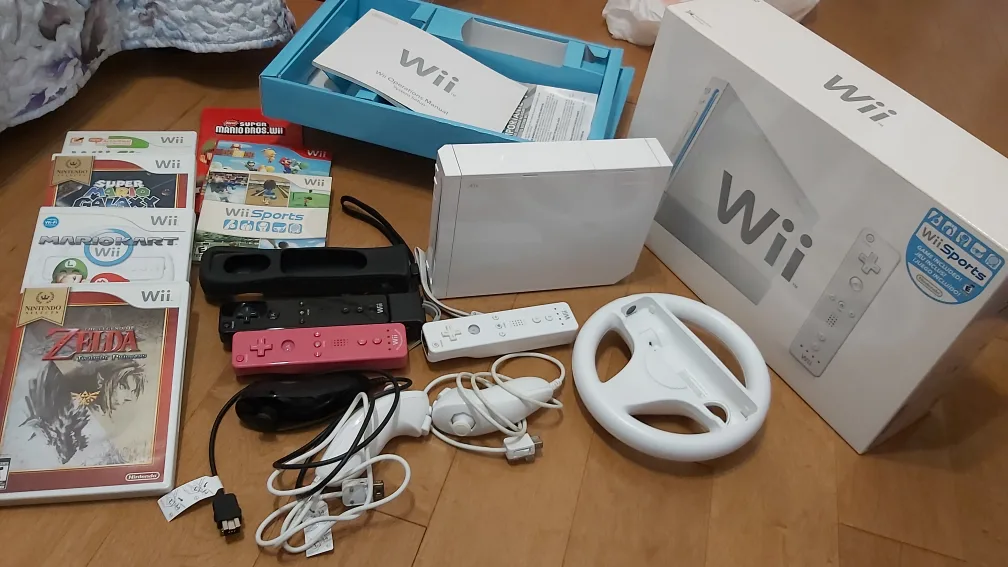Excellent Condition Complete in Box wii with Games and Wiimotes thumbnail