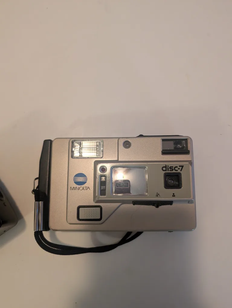 Nikon AF400D & Minolta Disc-7 Film Cameras image indicator(3)