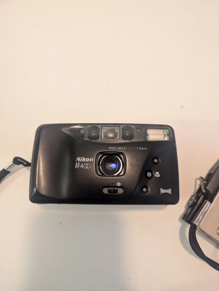 Nikon AF400D & Minolta Disc-7 Film Cameras image indicator(2)