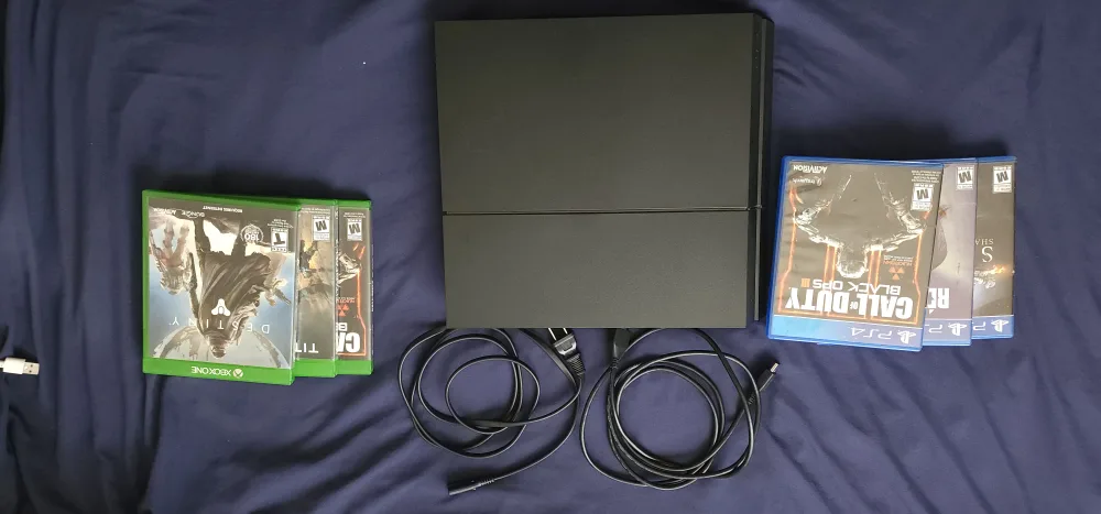 PlayStation 4 with Games and Controllers image indicator(3)