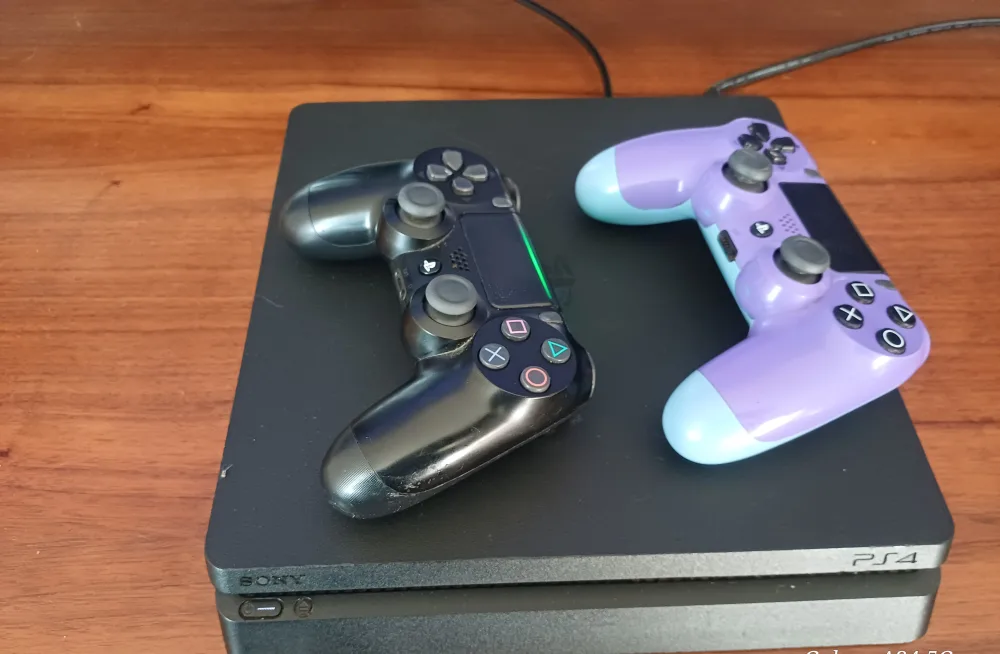 Sony PlayStation 4 with 2 Controllers and games thumbnail