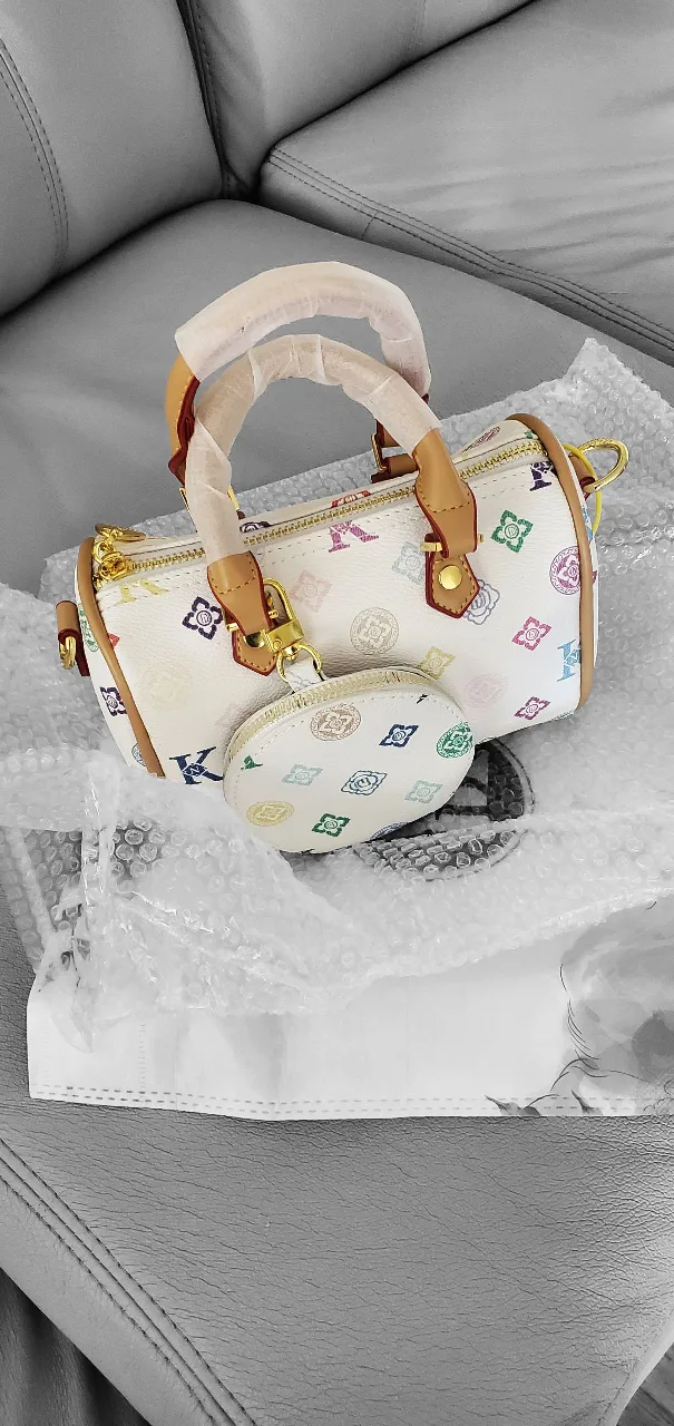 Patterned barrel handbag with coin purse image indicator(2)