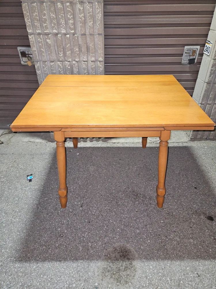 Solid oak table has two pull-out leafs. Good condition thumbnail