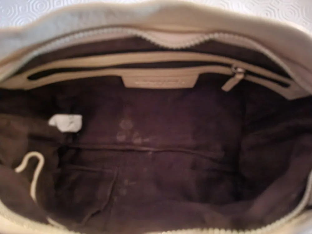 Danier tan shoulder bag with tassel.. image indicator(7)