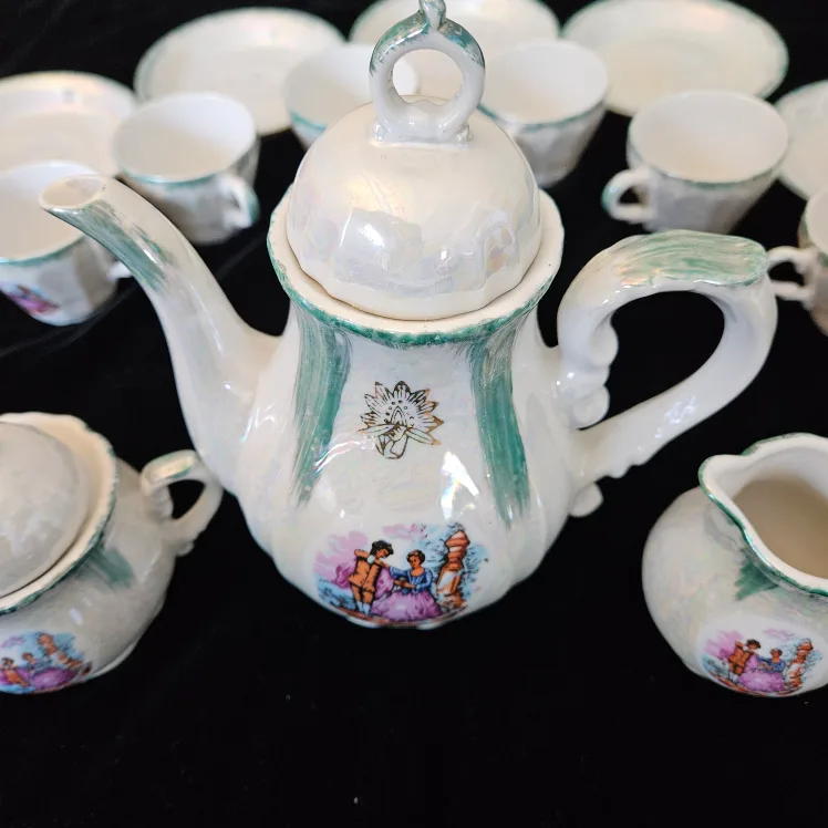 Vintage Tea Set with Teapot, Cups, and Saucers image indicator(3)