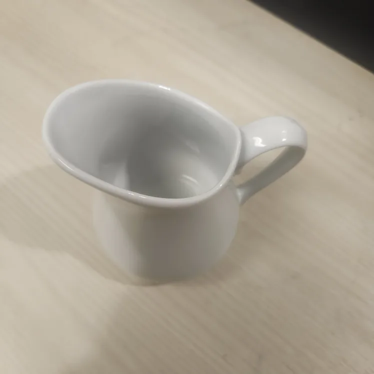 White Ceramic Creamer Pitcher image indicator(2)