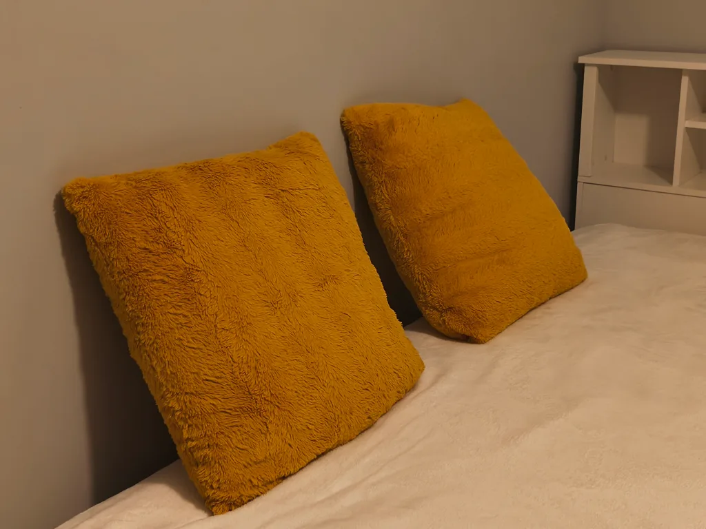 A pair of Yellow Throw Pillows thumbnail