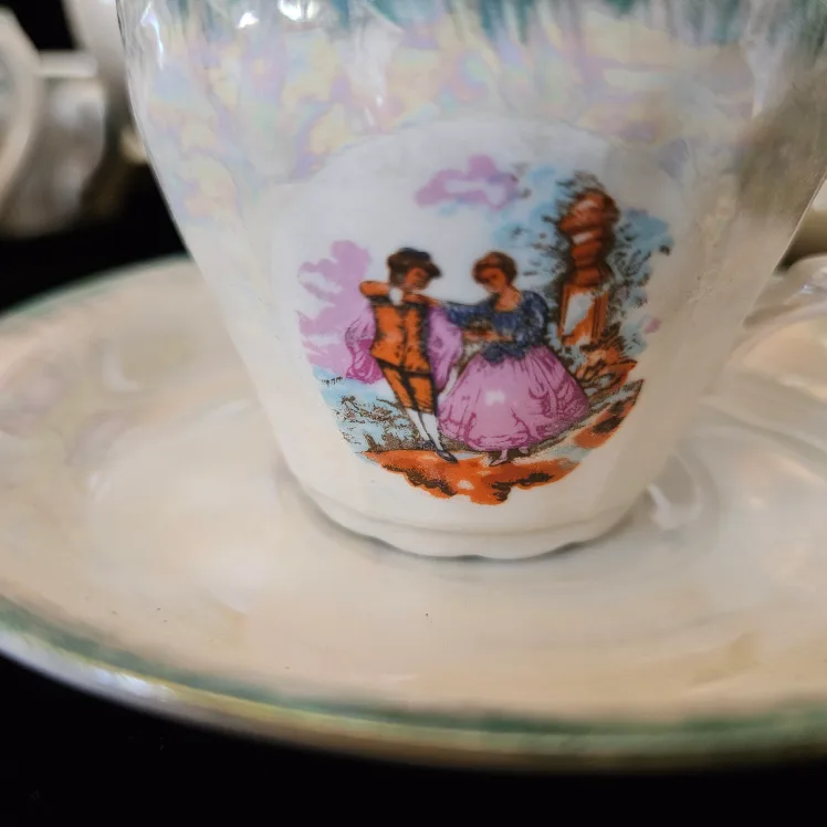 Vintage Tea Set with Teapot, Cups, and Saucers image indicator(2)