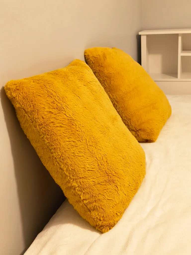 A pair of Yellow Throw Pillows thumbnail
