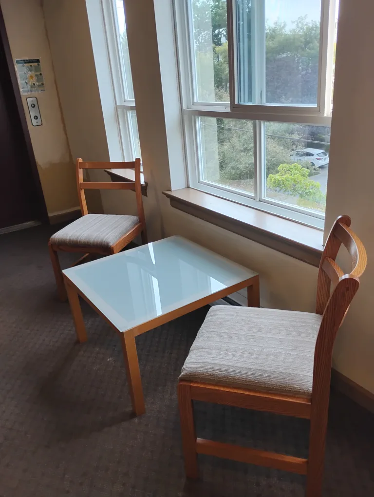 Two Oak Chairs with Cushioned Seats and Opaque Glass Table image indicator(4)