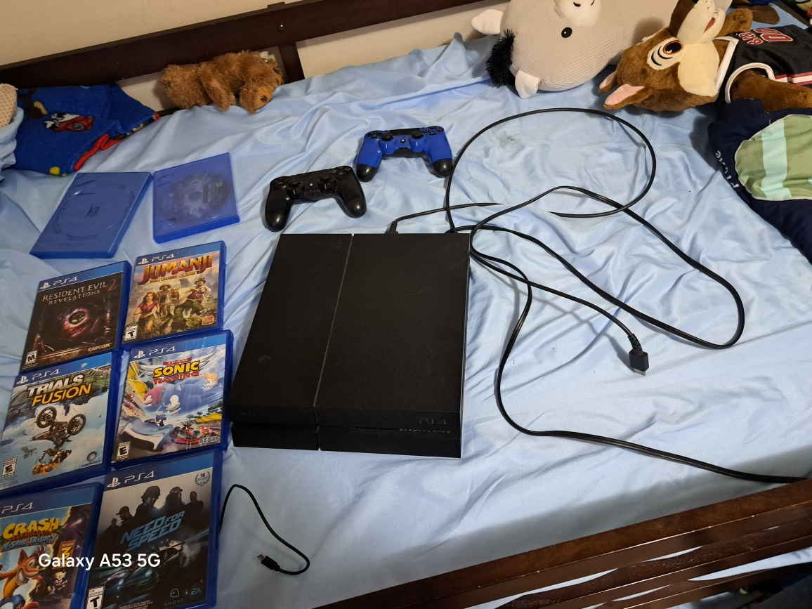 PlayStation 4 w/ Games & Controllers