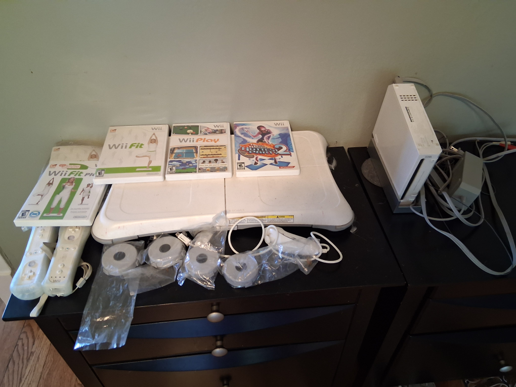 Nintendo Wii Bundle: Wii Fit, Wii Play, and More!