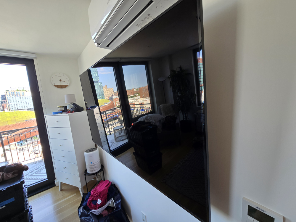 75 inch digital TV with wallount and legs.