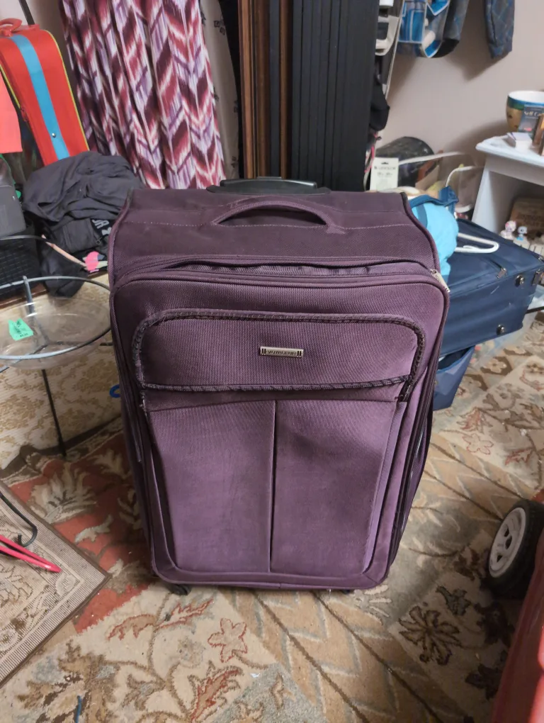 Voyager big suitcase burgundy color. lots of departments thumbnail