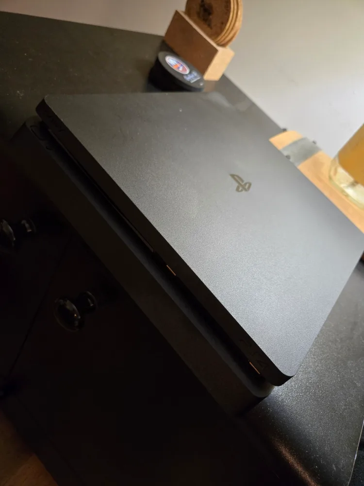 PlayStation 4 Slim with Controller Charging Station & games thumbnail