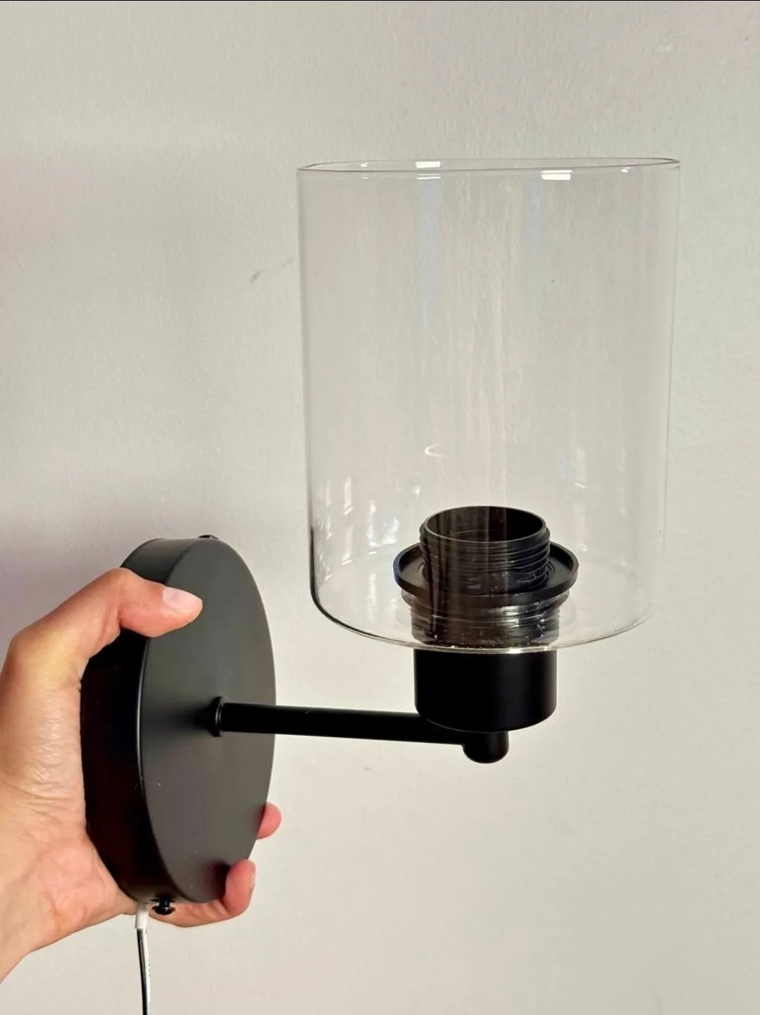 A Pair of Black Wall Sconce with Clear Glass Shade thumbnail