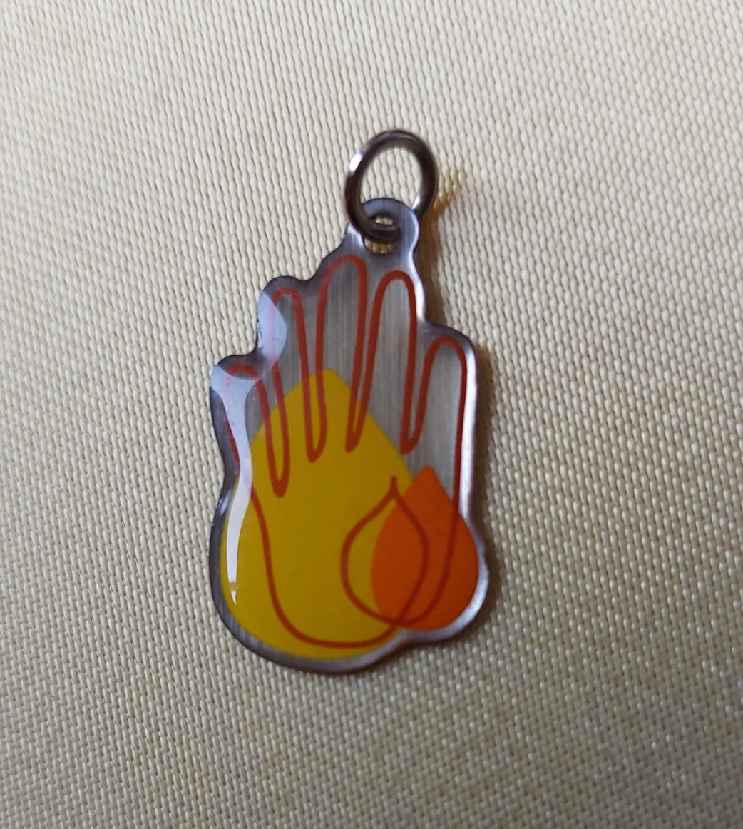 Hand in Flame Pendant thumbnail