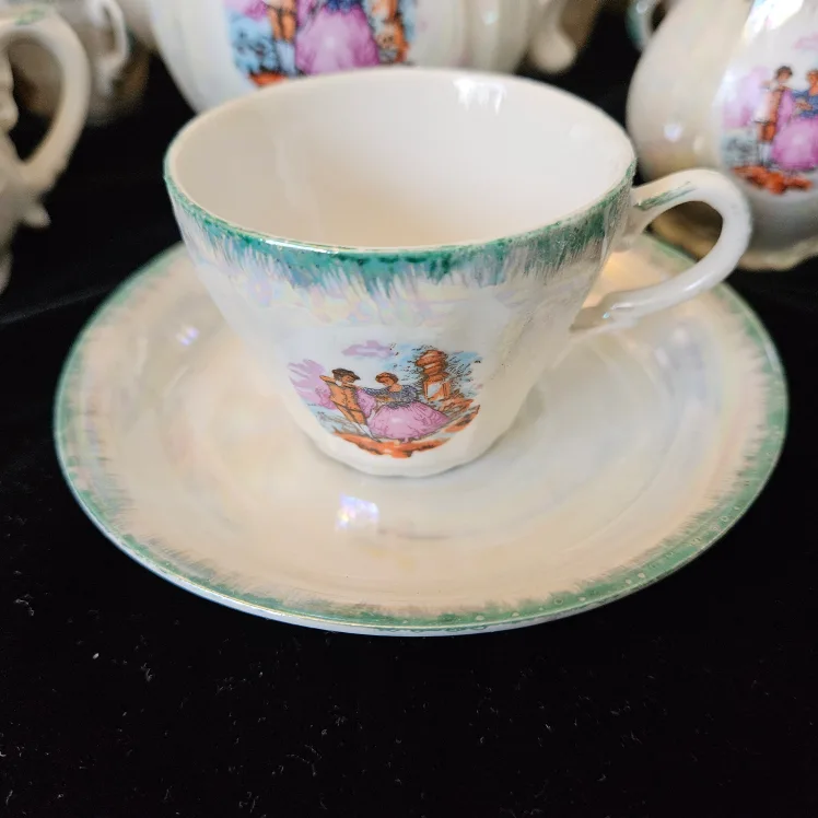 Vintage Tea Set with Teapot, Cups, and Saucers image indicator(4)