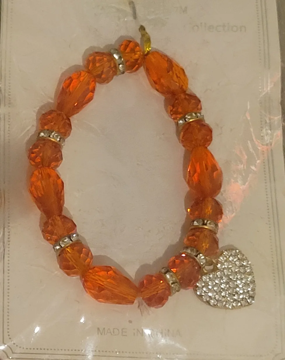 HeartPop: Orange Beaded Charm Bracelet thumbnail