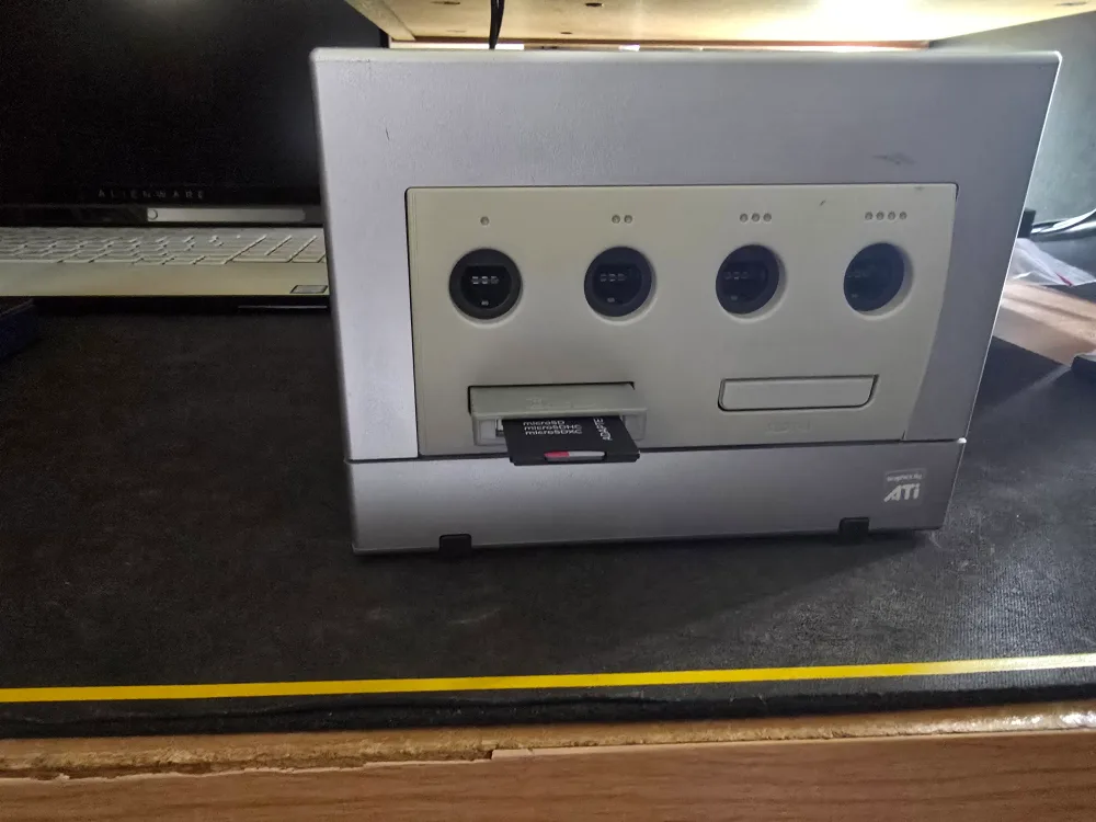 Moddded Gamecube with Picboot chip installed and controllers thumbnail