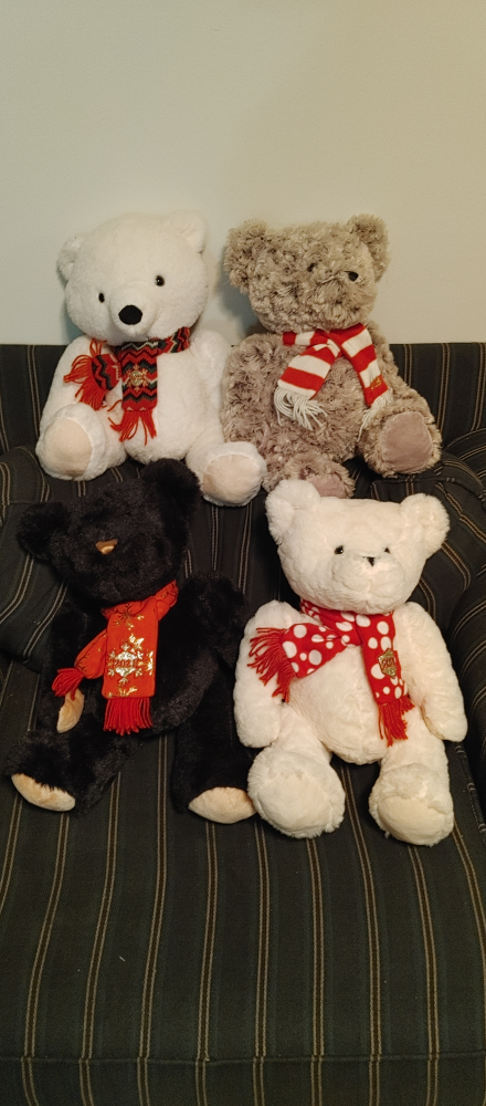 Four Plush Teddy Bears with Scarves