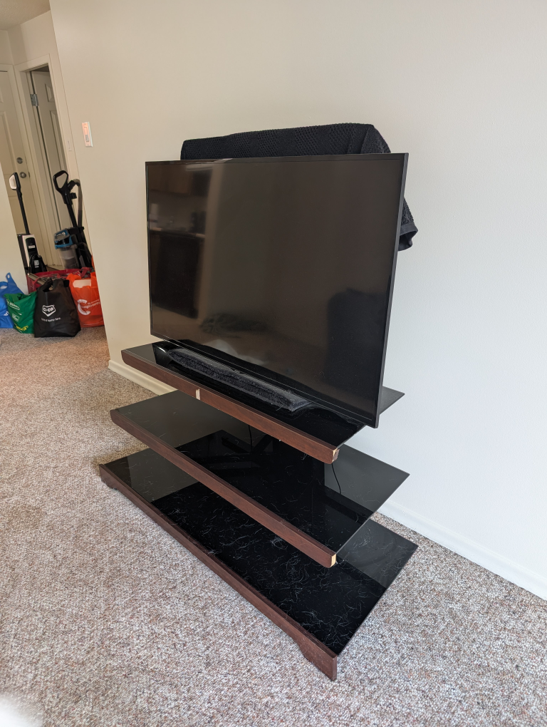 Black Glass with Wood TV Stand (TV not included)