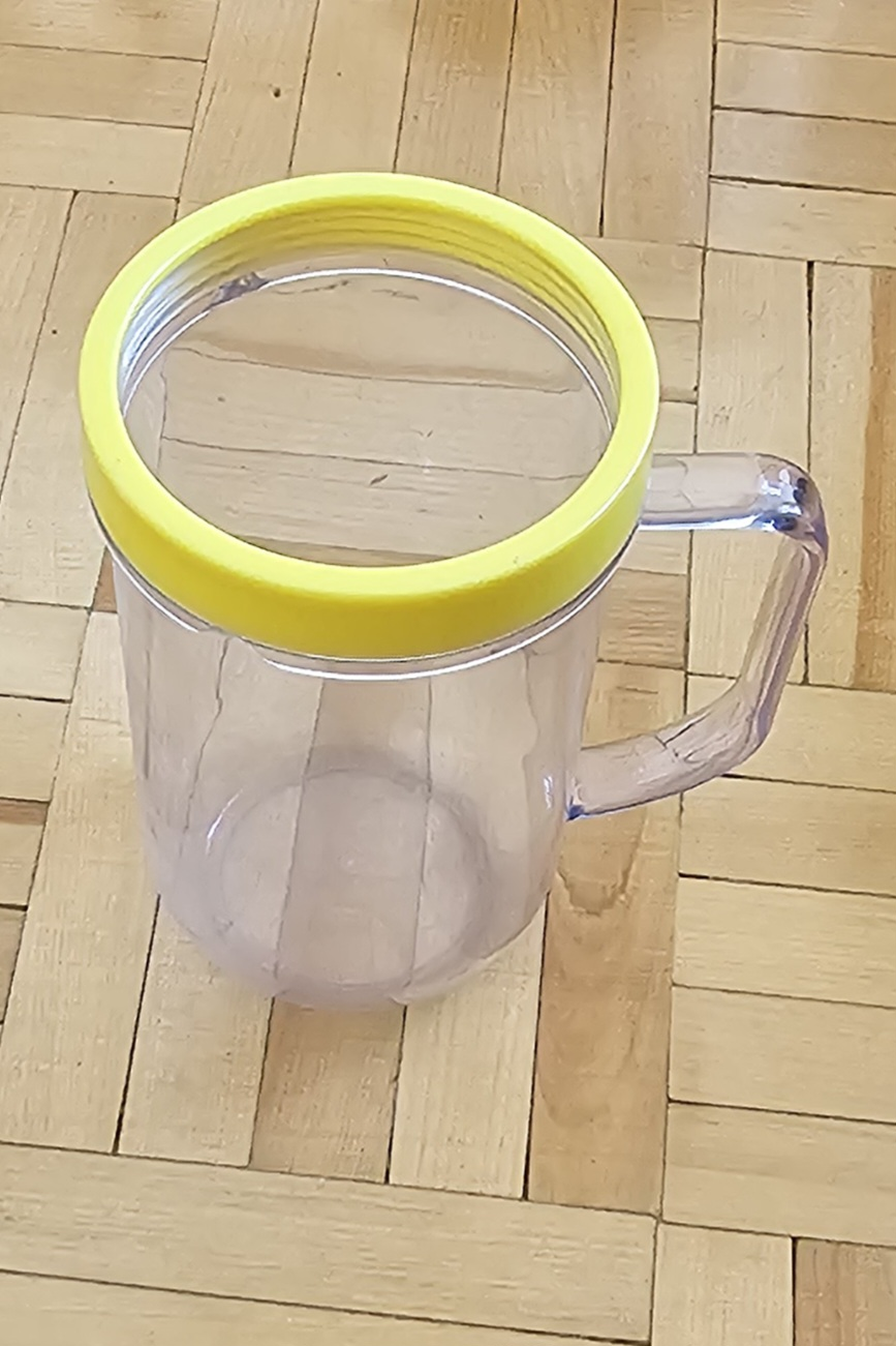 Clear Plastic Mug with Yellow Lid