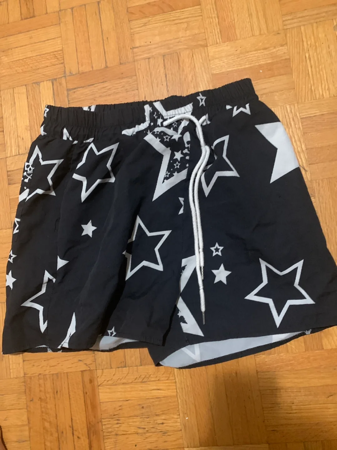 Black swim trunks with star pattern thumbnail