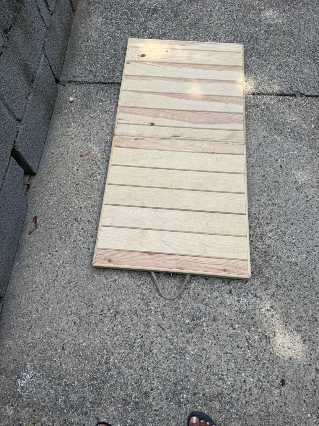 Wooden foldable table with screw on legs.