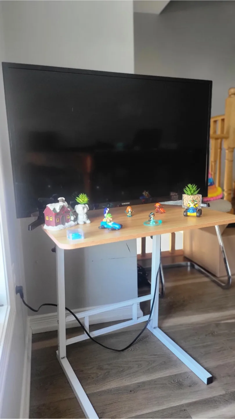 TV with an Adjustable Laptop Desk Table image indicator(2)