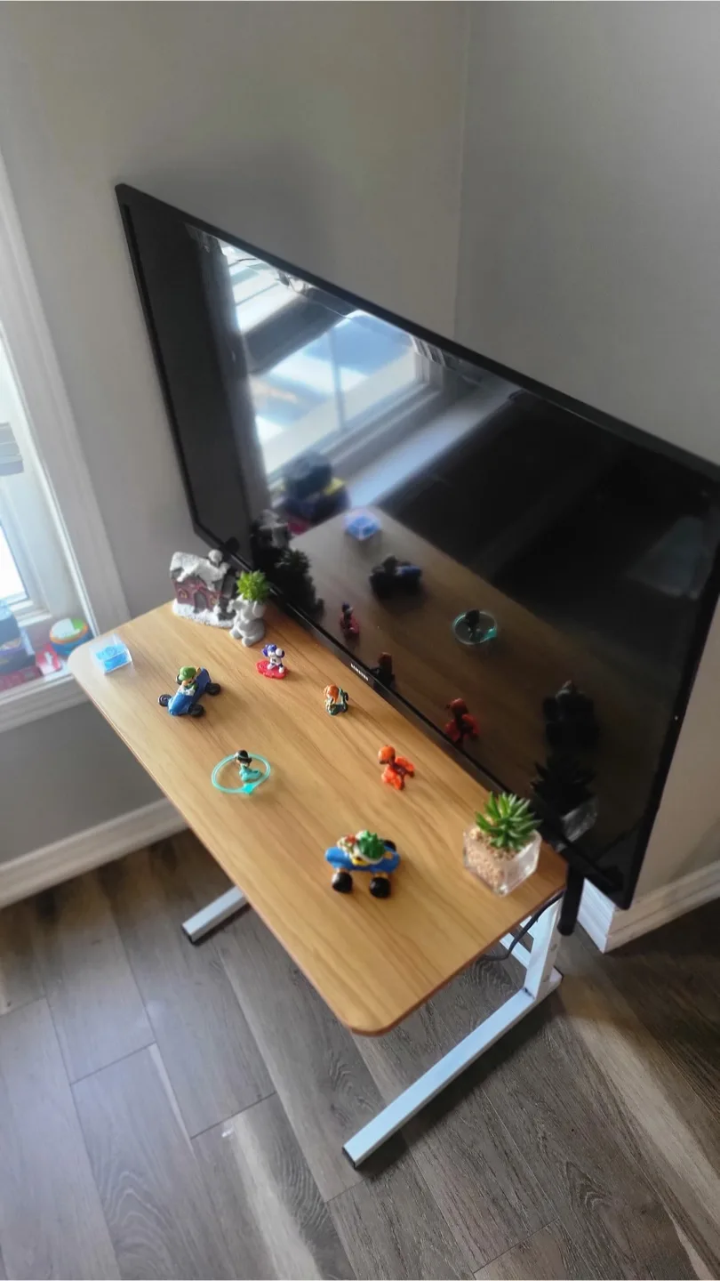 TV with an Adjustable Laptop Desk Table image indicator(3)