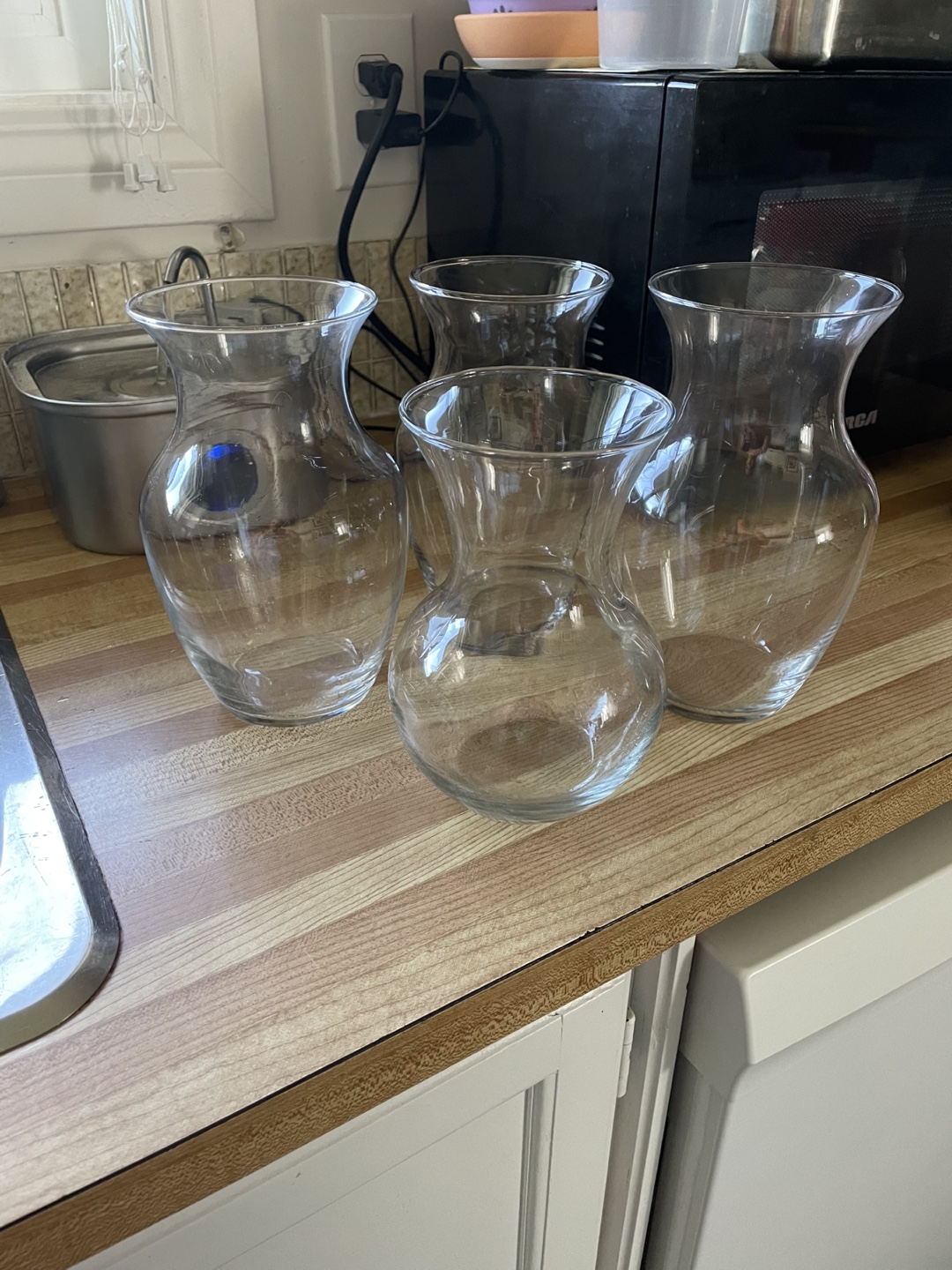Four Clear Glass Vases
