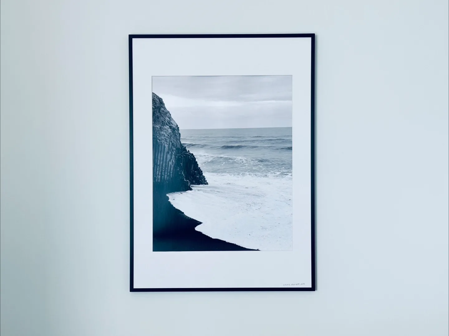 Framed print. Black and white print of black sand beach thumbnail