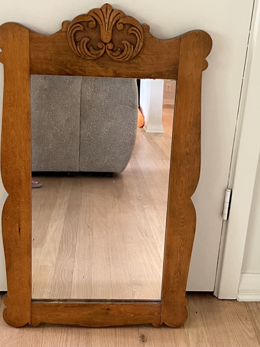 Antique mirror with carved wooden frame