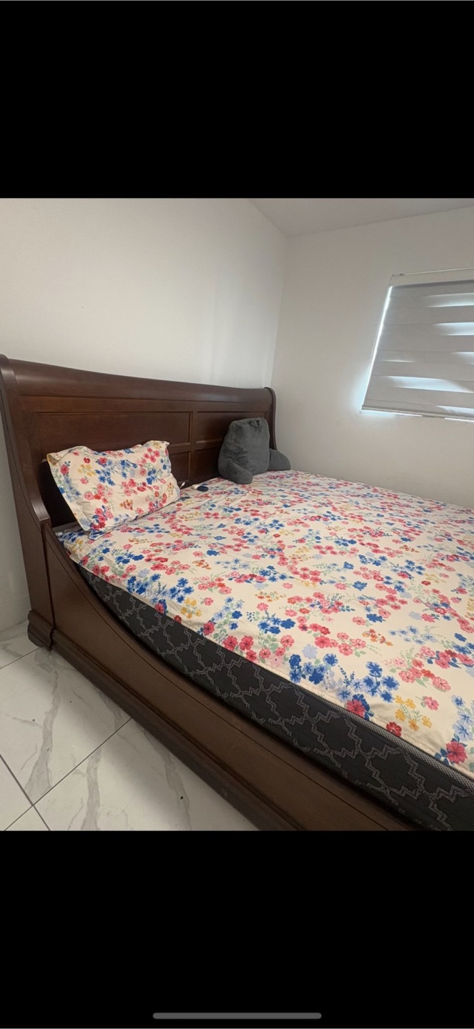Wooden Bed Frame with Floral Bedding - photo 2