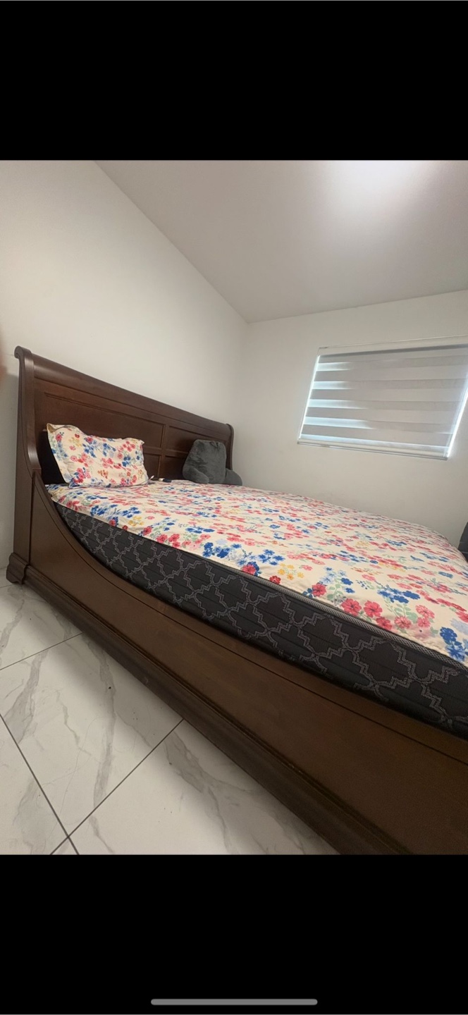 Wooden Bed Frame with Floral Bedding - photo 3