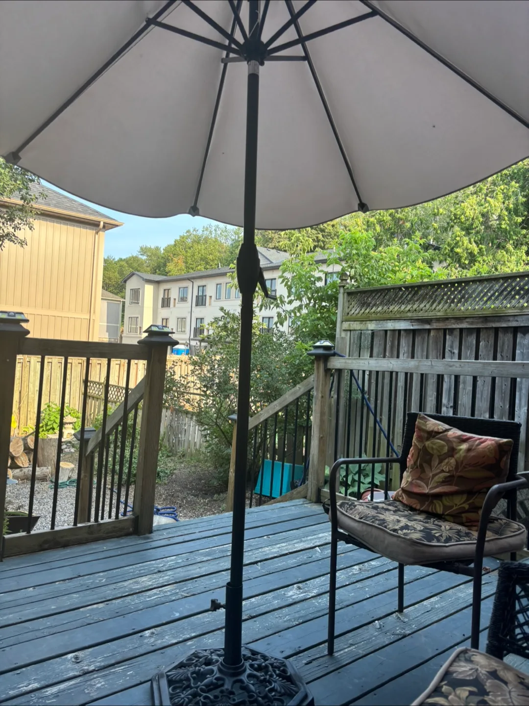 Patio umbrella with vintage wrought iron base image indicator(2)