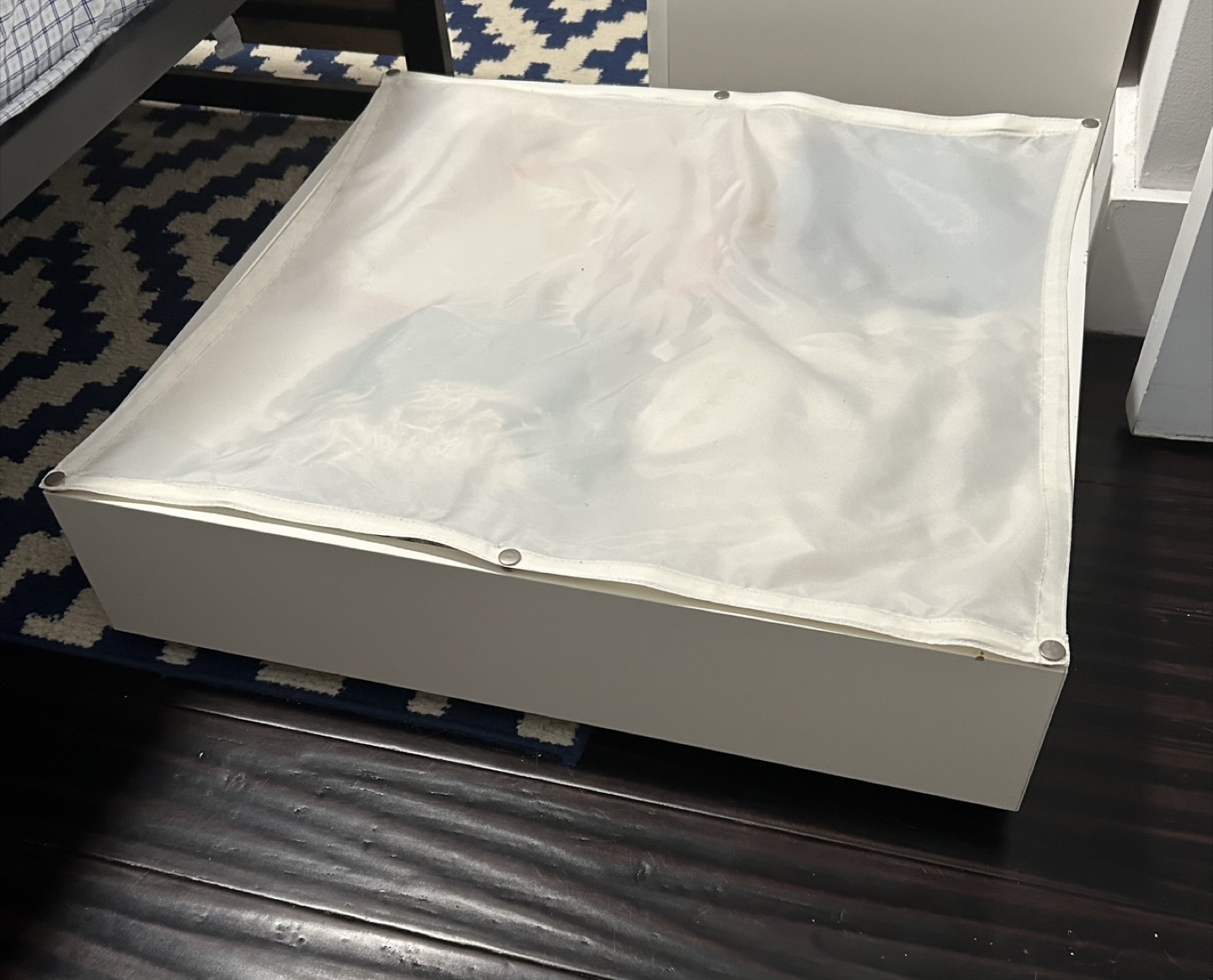 Ikea under bed rolling storage unit.