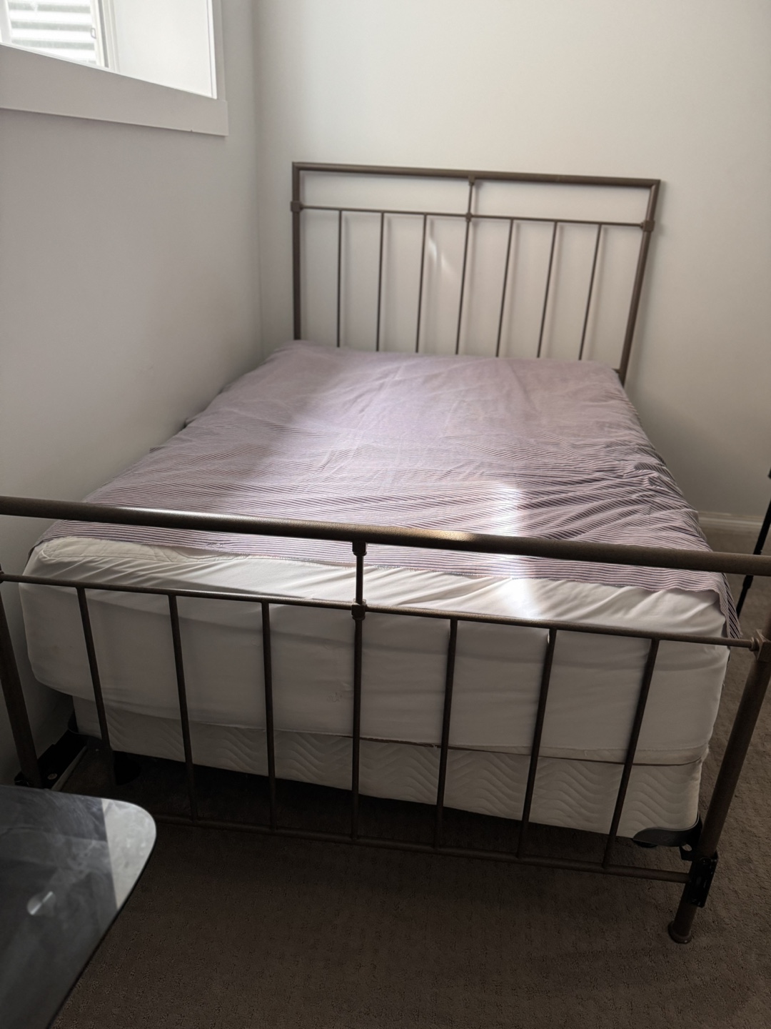 Double bed with metal frame and mattress