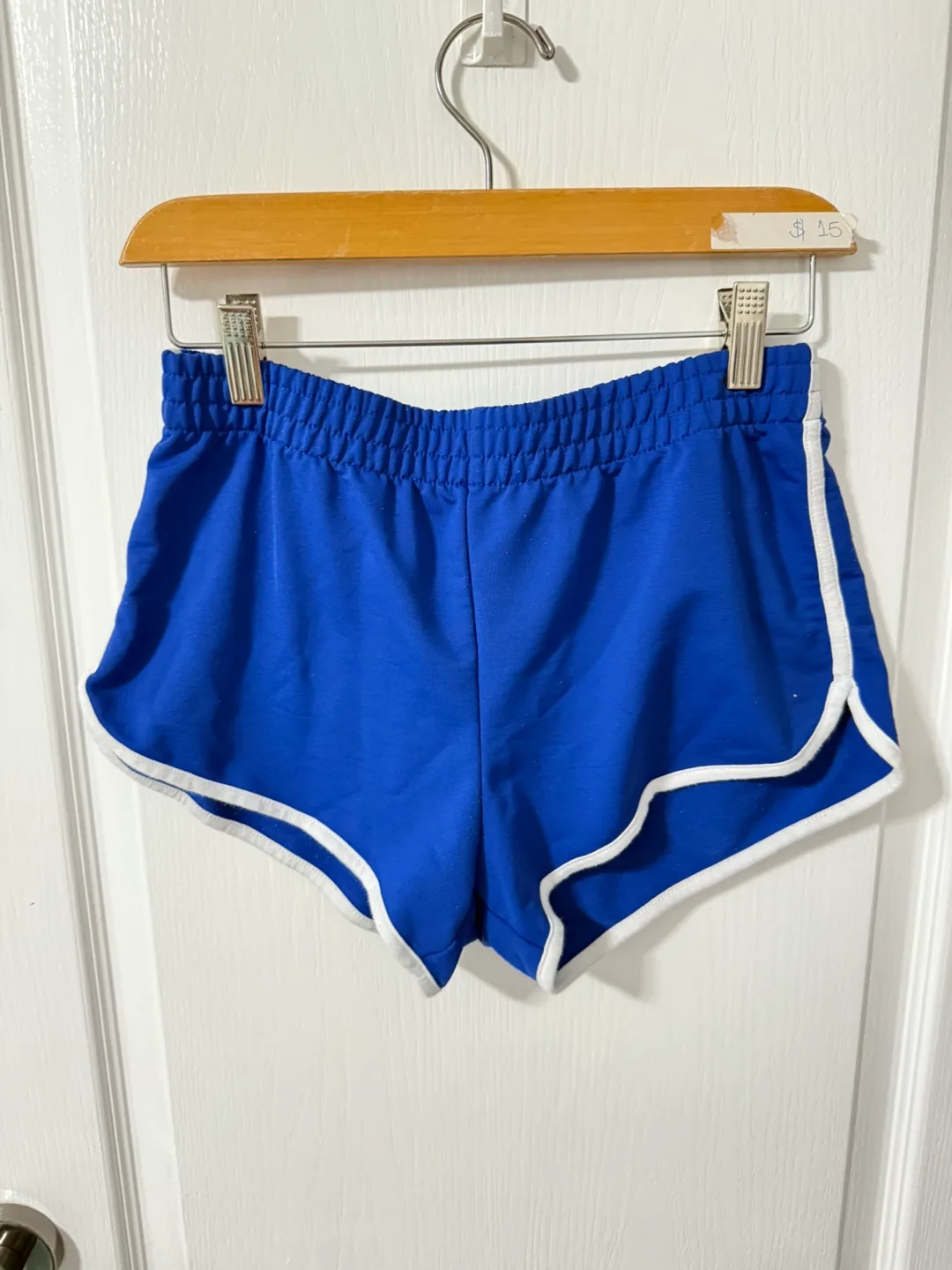 Blue athletic shorts, white trim thumbnail
