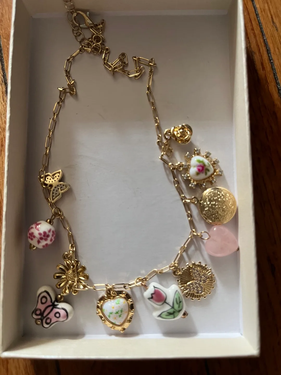 Gold Charm Necklace with Floral Accents thumbnail