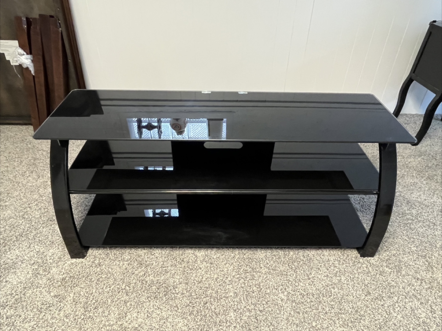Black glass and metal TV stand