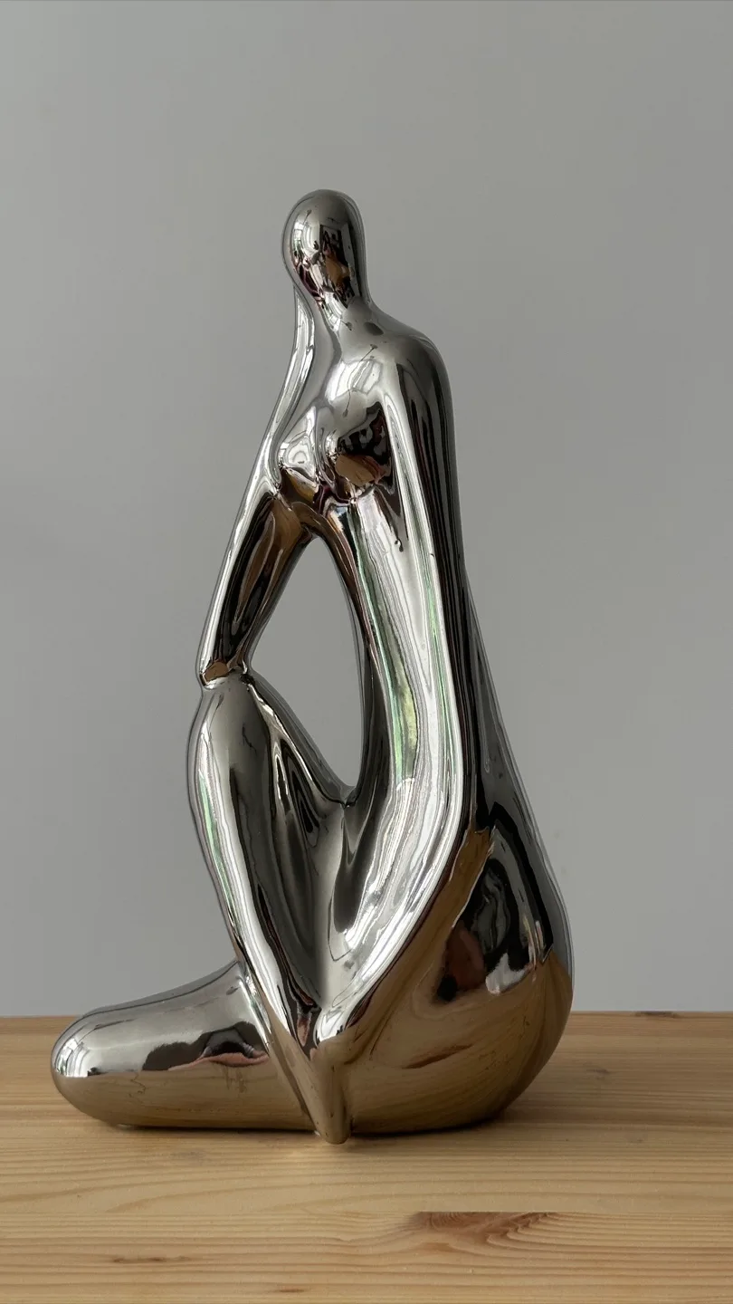 Silver metal Sitting Figure thumbnail