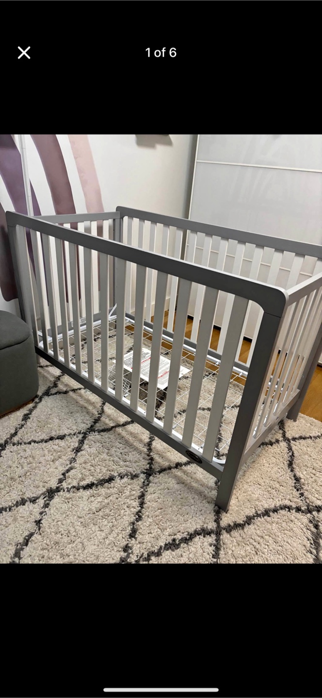 Grey and White Baby Crib