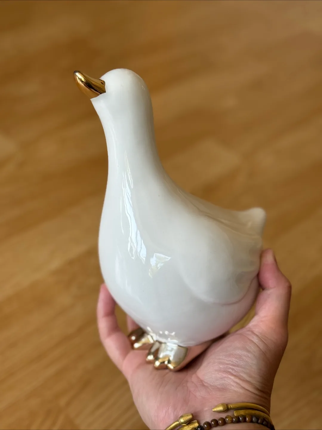 White Ceramic Duck Figurine with Gold Accents image indicator(3)